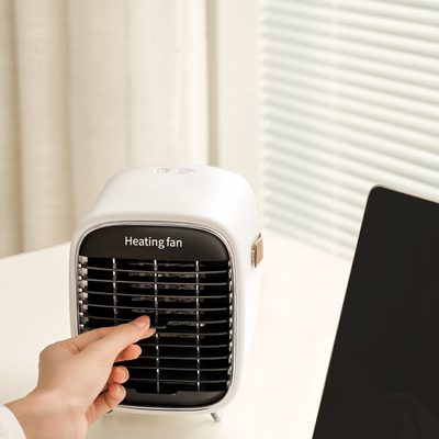 ABS ব্যক্তিগত বৈদ্যুতিক ফ্যান হিটার 600W 900W সিরামিক ছোট স্পেস হিটার ফ্যান